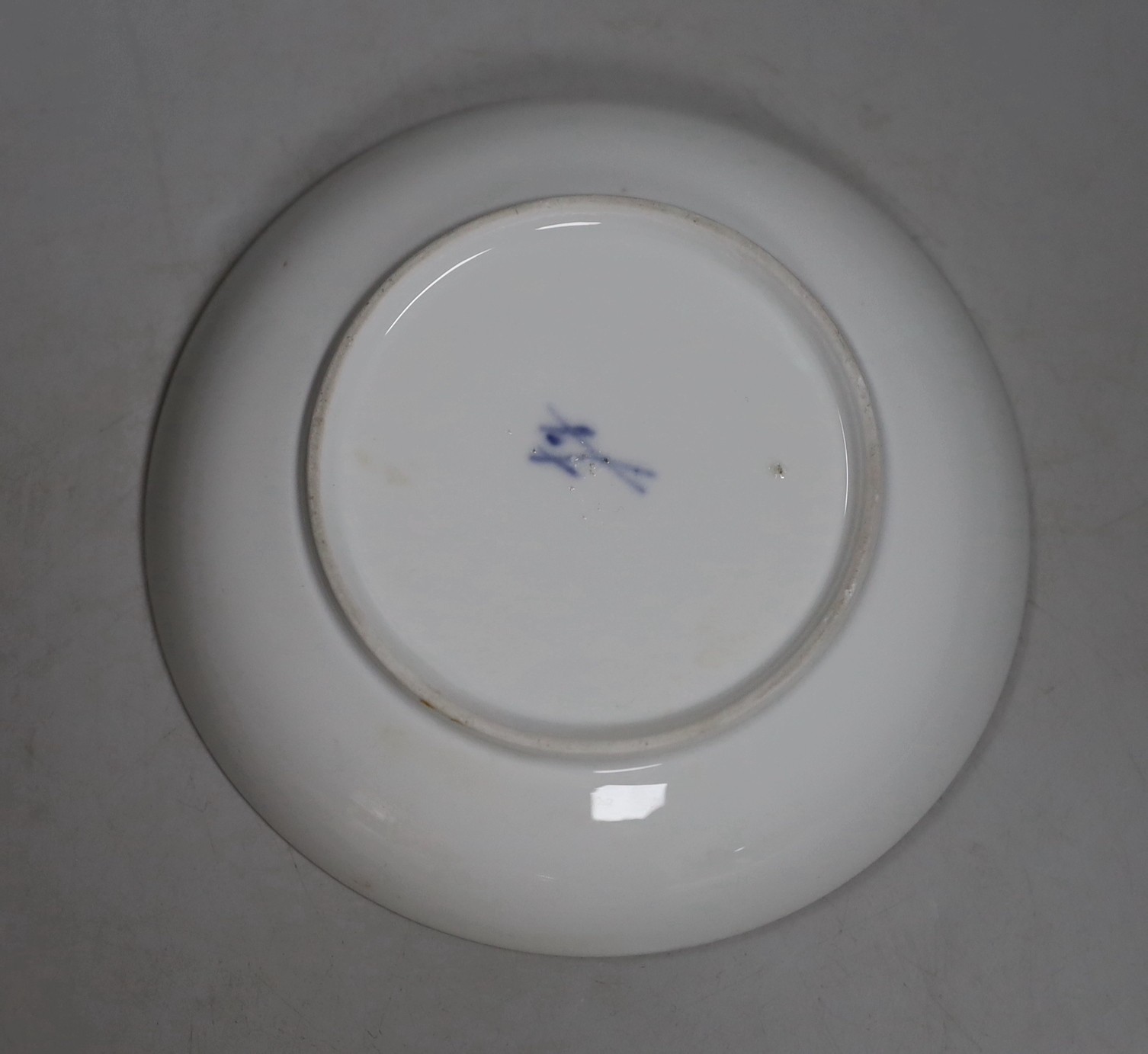A Meissen dot period flower painted cup and saucer, c.1770
